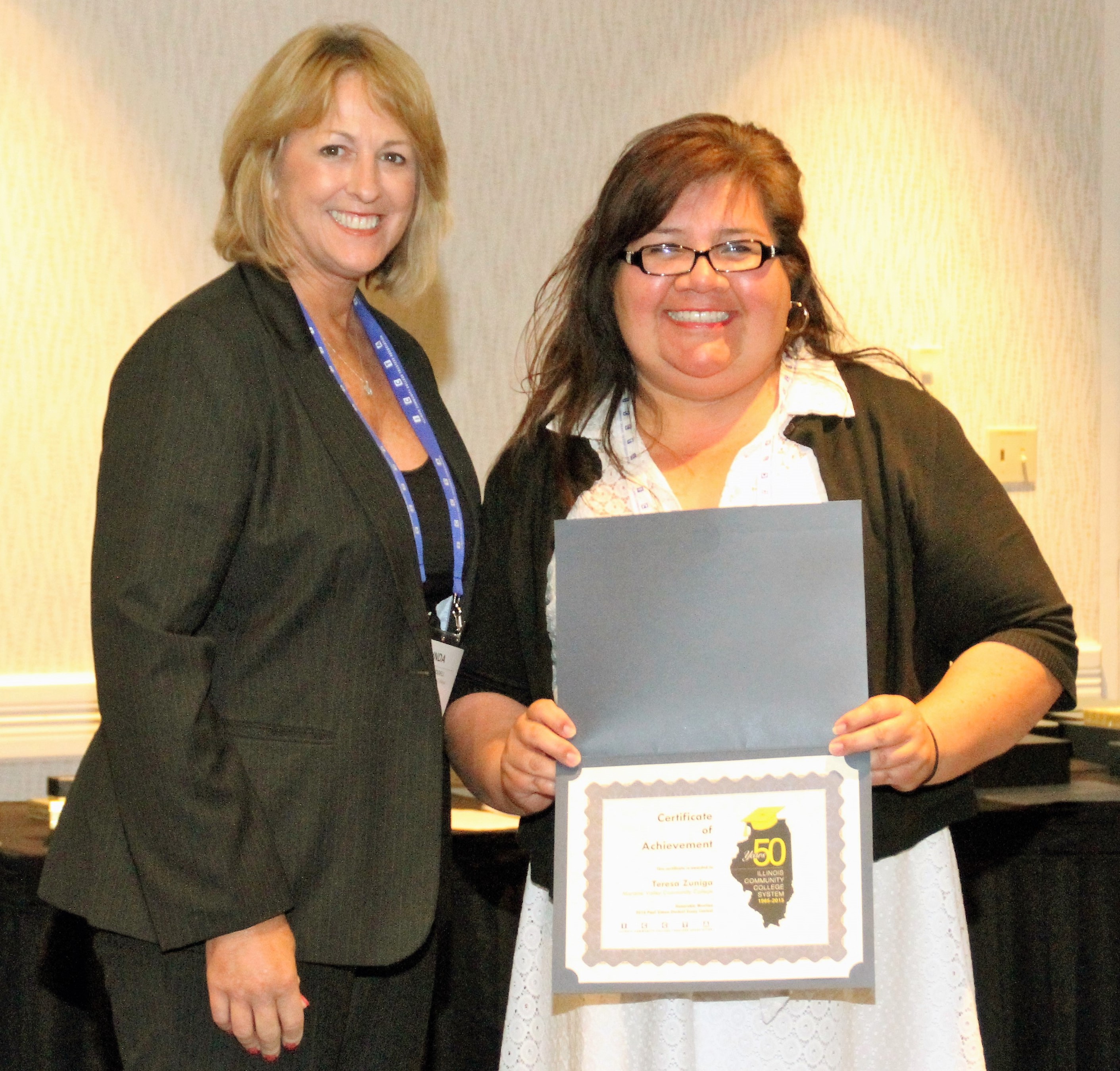 Moraine Valley Community College student Teresa Zuniga accepts her $250 Paul Simon Student Essay Contest scholarship
from ICCTA vice president Linda Liddell.