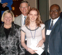 Elgin Community College student Christine Pemberton (third from left)
accepts her $500 scholarship from ICCTA president Kathy Wessel, Illinois Community College System Foundation board member 
Jim Berkel, and ECC president David Sam.