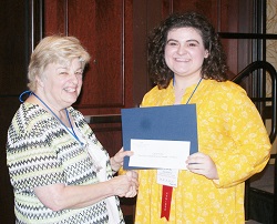 Southeastern Illinois College student Callie Smith (right) accepts her $500 Paul Simon Student Essay Contest scholarship
from ICCTA secretary Kathy Spears.