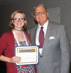 Kaskaskia College student Lauren Stengel accepts her $250 Paul Simon Student Essay Contest scholarship
from Illinois Community College System Foundation president Dr. Joe Kanosky.