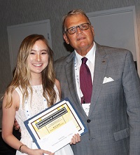 Southeastern Illinois College student Ruth Chae accepts her $500 Paul Simon Student Essay Contest scholarship
from Illinois Community College System Foundation president Dr. Joe Kanosky.