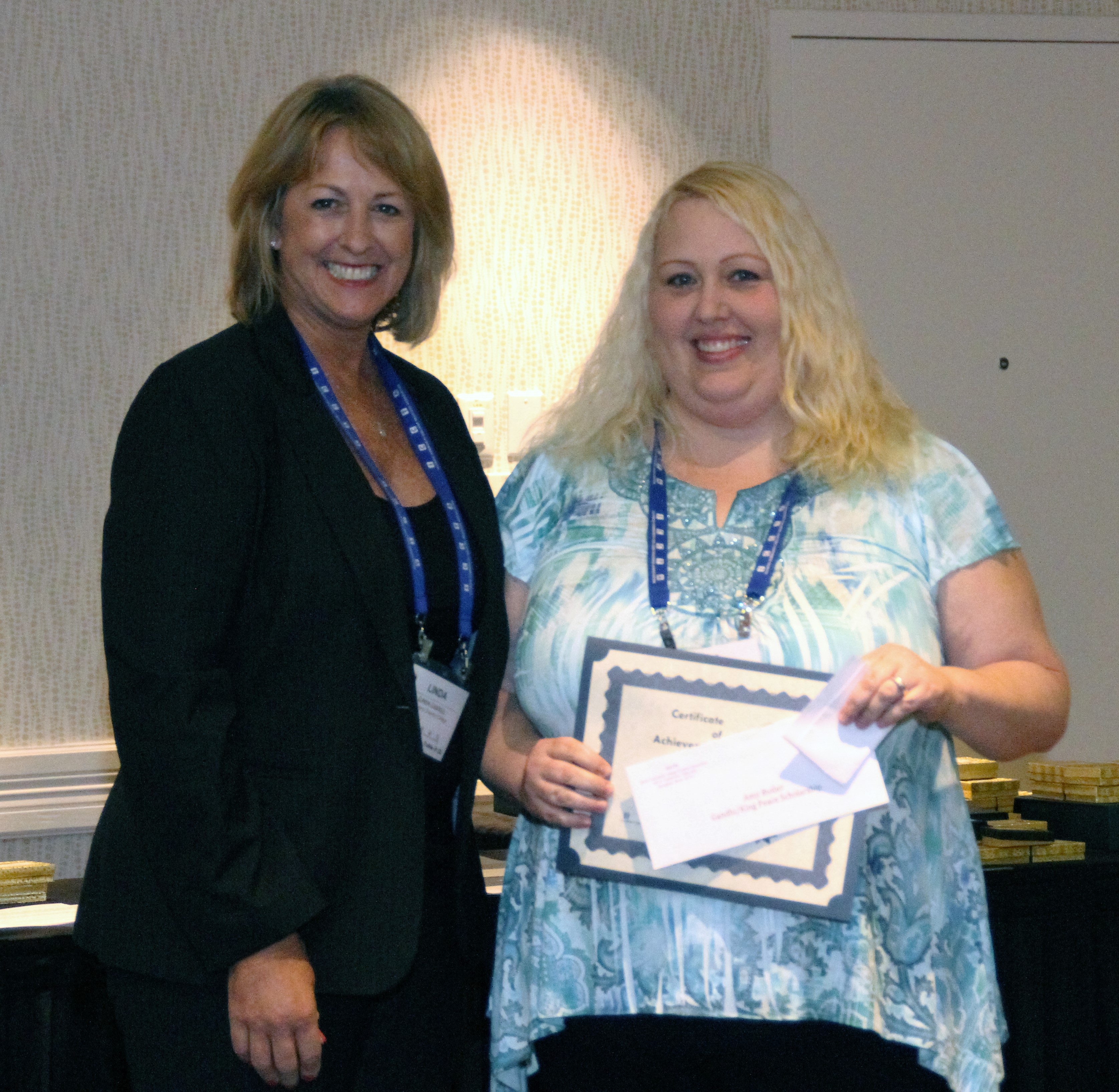 John A. Logan College student Amy Butler accepts her $500 Gandhi/King Peace Essay Scholarship
from ICCTA vice president Linda Liddell.