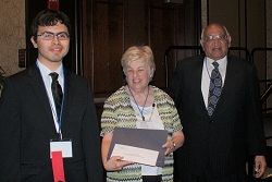 Elgin Community College student Mauro Rosiles (left) accepts his $500 Gandhi/King Peace Essay Scholarship
from ICCTA secretary Kathy Spears and Oakton Community College trustee emeritus Jody Wadhwa.